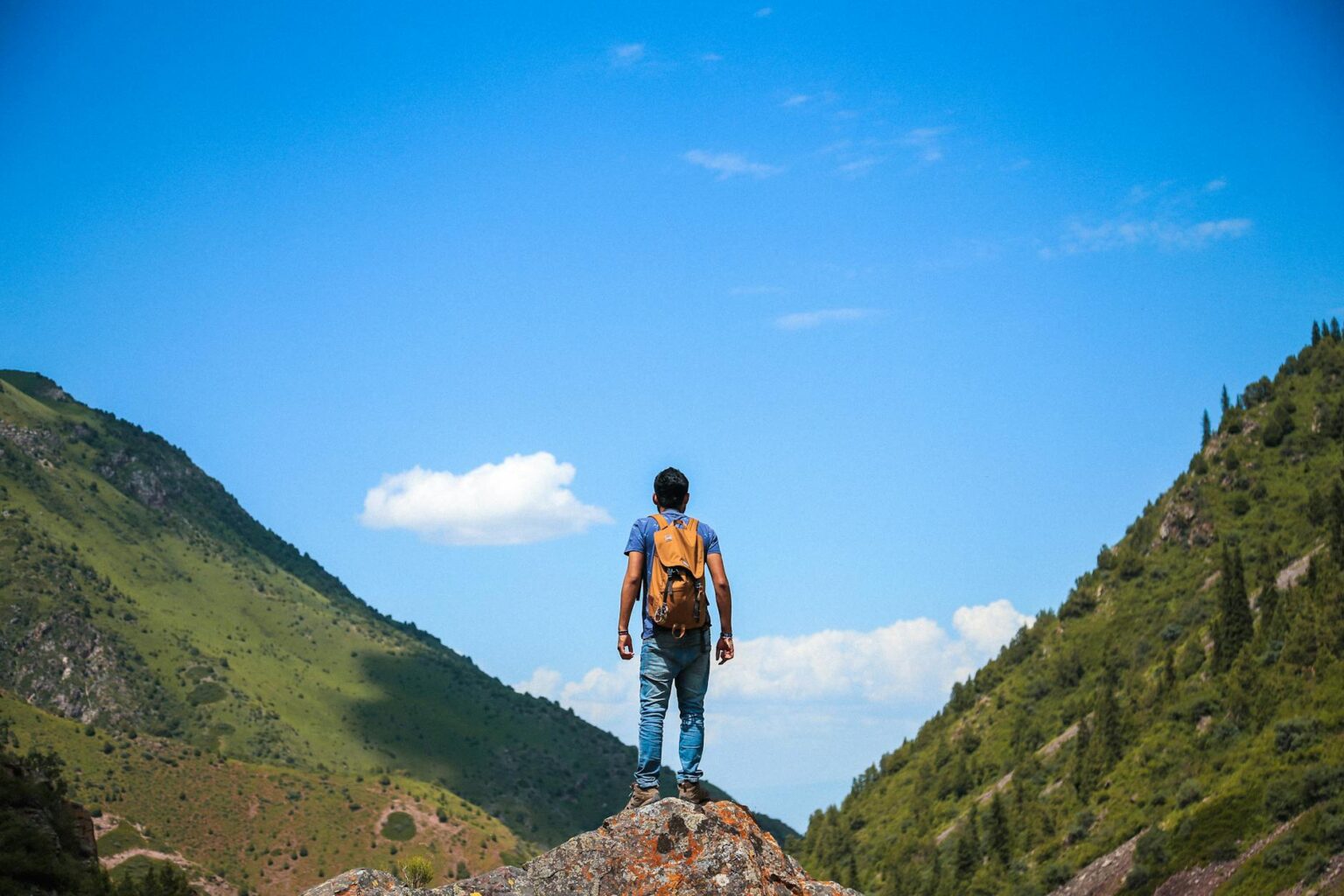 man on top of mountain