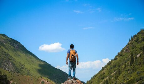 man on top of mountain